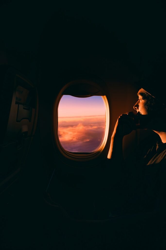 Traveller looking out of a plane window