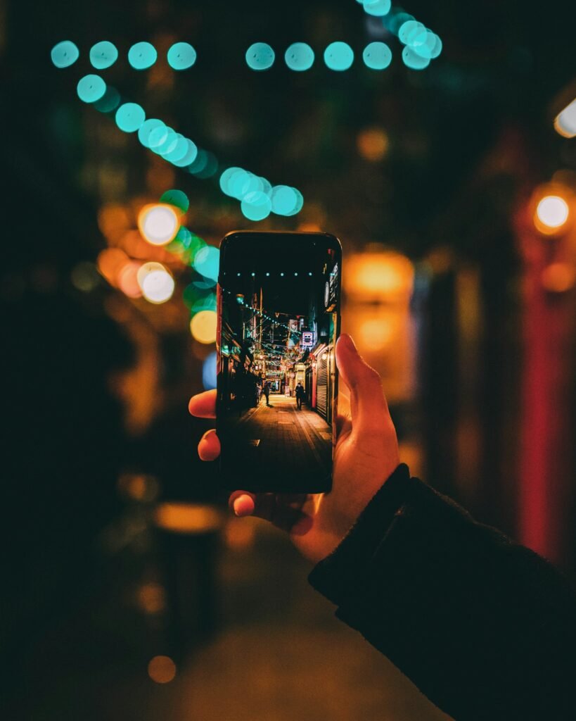 Person taking a photo of a street with a smartphone